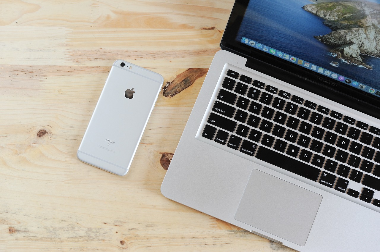 Iphone and macbook on a desk